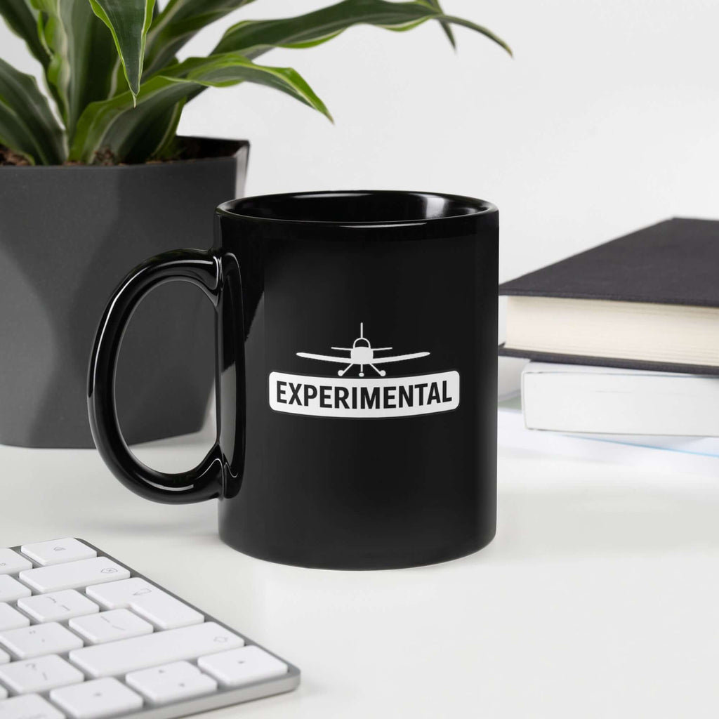 black glossy ceramic mug with 'EXPERIMENTAL' text and airplane design, perfect for aviation enthusiasts.